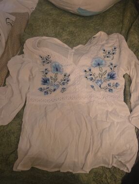 White Women's Embroidered V-Neck Peasant Top with Blue Floral Detail